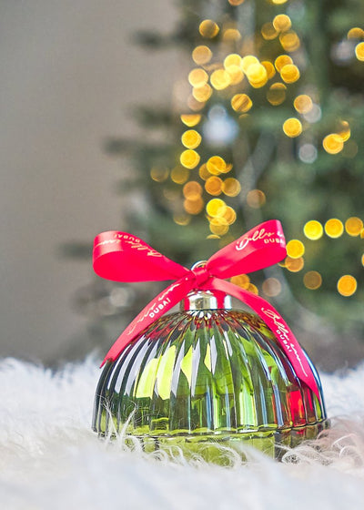 green bauble with red ribbon