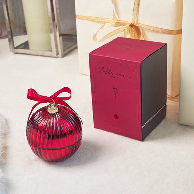 red bauble with red ribbon and red packaging